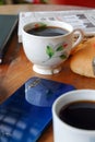 Close-up photo of someone drinking tea in the front yard of his house Royalty Free Stock Photo