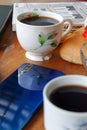 Close-up photo of someone drinking tea in the front yard of his house Royalty Free Stock Photo