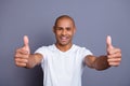 Close up photo strong healthy teeth dark skin he him his guy bald head approve show thumbs fingers up advise buy buyer Royalty Free Stock Photo