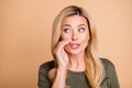 Close up photo of suspecting woman whispering you secret green information isolated beige pastel color background