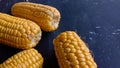 Close-up photo of sweet corn on black background