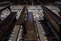 Close up photo taken inside Milan Cathedral / Duomo di Milano of wooden pews and ornate floor.