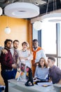 Close up photo of talented multiracial friendly colleagues looking at the camera Royalty Free Stock Photo