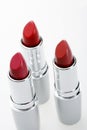 A close up photo of three lipsticks