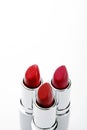 A close up photo of three lipsticks