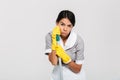 Close-up photo of tired housekeeper leaned on mop while standing Royalty Free Stock Photo