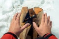 Close-up photo - tourist warms his hands near the fire in the wi Royalty Free Stock Photo