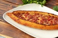 Close up of Turkish Pide bread on wooden table Royalty Free Stock Photo