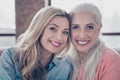 Close up photo two amazing she her ladies mom granddaughter child granny grandmother hugging hold close lovely wear Royalty Free Stock Photo