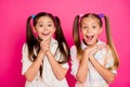 Close up photo two little age girls hands arms palms together yell scream shout want buy buyer tablet telephone app pda Royalty Free Stock Photo