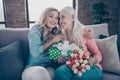 Close up photo two people she her ladies grandmother grandchildren visit birthday party giftbox fresh flowers overjoyed