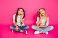 Close up photo two people little age she her girls hold hands arms telephones tell parents news glad sit floor wear