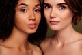 Close up photo of two perfect young pretty women look camera together with no makeup isolated on khaki color background Royalty Free Stock Photo