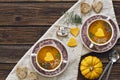 Close-up photo of two plates with fresh homemade pumpkin cream soup with seeds and heart shape toasts Royalty Free Stock Photo