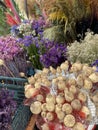 close-up photo of various bright juicy natural dried flowers and poppies in a basket