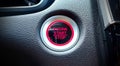 Extreme closeup shot of an electronic car engine start stop ignition button