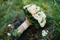 Close-up photo of wedding bouquet made of roses on the stump. Royalty Free Stock Photo