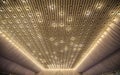 photo of a white ceiling and a part of a wall decorated with tulle and lights in a wedding banquet hall Royalty Free Stock Photo