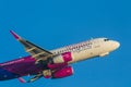 Close-up photo of a wizzair plane on the sky