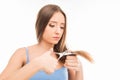 Close up photo of woman cutting her hair. Problem of split ends Royalty Free Stock Photo