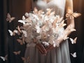 Close up photo of woman hands holding an elegant bridal bouquet with real flowers and decorated with silk butterflies Royalty Free Stock Photo