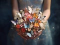 Close up photo of woman hands holding an elegant bridal bouquet with real flowers and decorated with silk butterflies Royalty Free Stock Photo