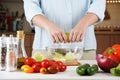 Close Up Photo of Woman Hands Making Fresh Salad on a Table Full with Organic Vegetables Royalty Free Stock Photo