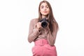 Portrait of woman in hat taking a photo with digital camera on white background Royalty Free Stock Photo