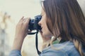 Close up photo of woman taking picture on her digicam for having happy memories of an old city, beauty fashion lifestyle leisure f