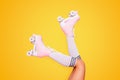 Close up photo of woman& x27;s body part. Legs wearing cute sweet with shoelaces four wheeled roller blades Royalty Free Stock Photo