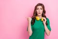 Close up photo worried lady wear trendy green clothes arm direct empty space disagree dislike prices isolated on pink