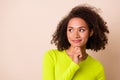 Close up photo of young attractive woman curly hair create business plan wear stylish yellow garment isolated on beige Royalty Free Stock Photo