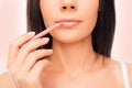 Close-up photo of young woman doing maquillage with lip`s liner, close up photo with arrows Royalty Free Stock Photo