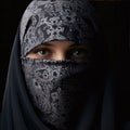 Close-up photo of a young woman wearing a black decorated niqab. Ramadan as a time of fasting and prayer for Muslims
