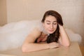 photo of a young woman in white foam relaxing in a hamam Royalty Free Stock Photo