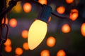 Close up Photograph of a Christmas Light with out of focus Lights in the Background Royalty Free Stock Photo