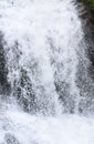 Water Falling with Force with Sprinkling White Foamy Drops - Close up