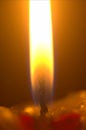 A close-up photograph of wax candle flame.