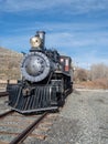 Vintage Steam Engine locomotive train on tracks in a desert setting. Royalty Free Stock Photo