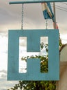 Close-up photography of a hanging metallic hotel signal