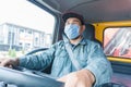 Truck driver wearing a mask