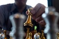 Close-up photos of checkmate hands on a chessboard during a chess game The concept of business victory strategy wins the intellige