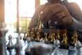Close-up photos of checkmate hands on a chessboard during a chess game The concept of business victory strategy wins the intellige