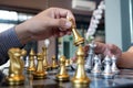 Close-up photos of checkmate hands on a chessboard during a chess game The concept of business victory strategy wins the intellige