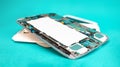 Tablet repair. Close-up disassembled mobile phone parts. Colorful blue background. Royalty Free Stock Photo