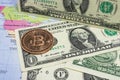 Close up physical bitcoin coin with US dollars and world map. Royalty Free Stock Photo