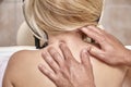 Close up, physiotherapist massage woman neck. rear view.