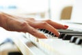 Close up of pianists hand playing piano. Shallow deep of field. Royalty Free Stock Photo