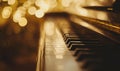 Close up of piano keys with golden bokeh background. Music concept Royalty Free Stock Photo