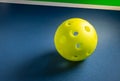Close up of pickleball ball on court